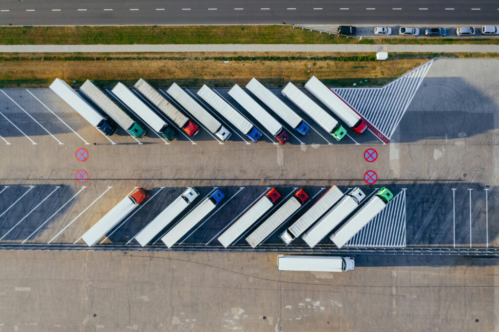 service Overhead shot of semi-trucks parked in Poznań, Poland, demonstrating transportation logistics.