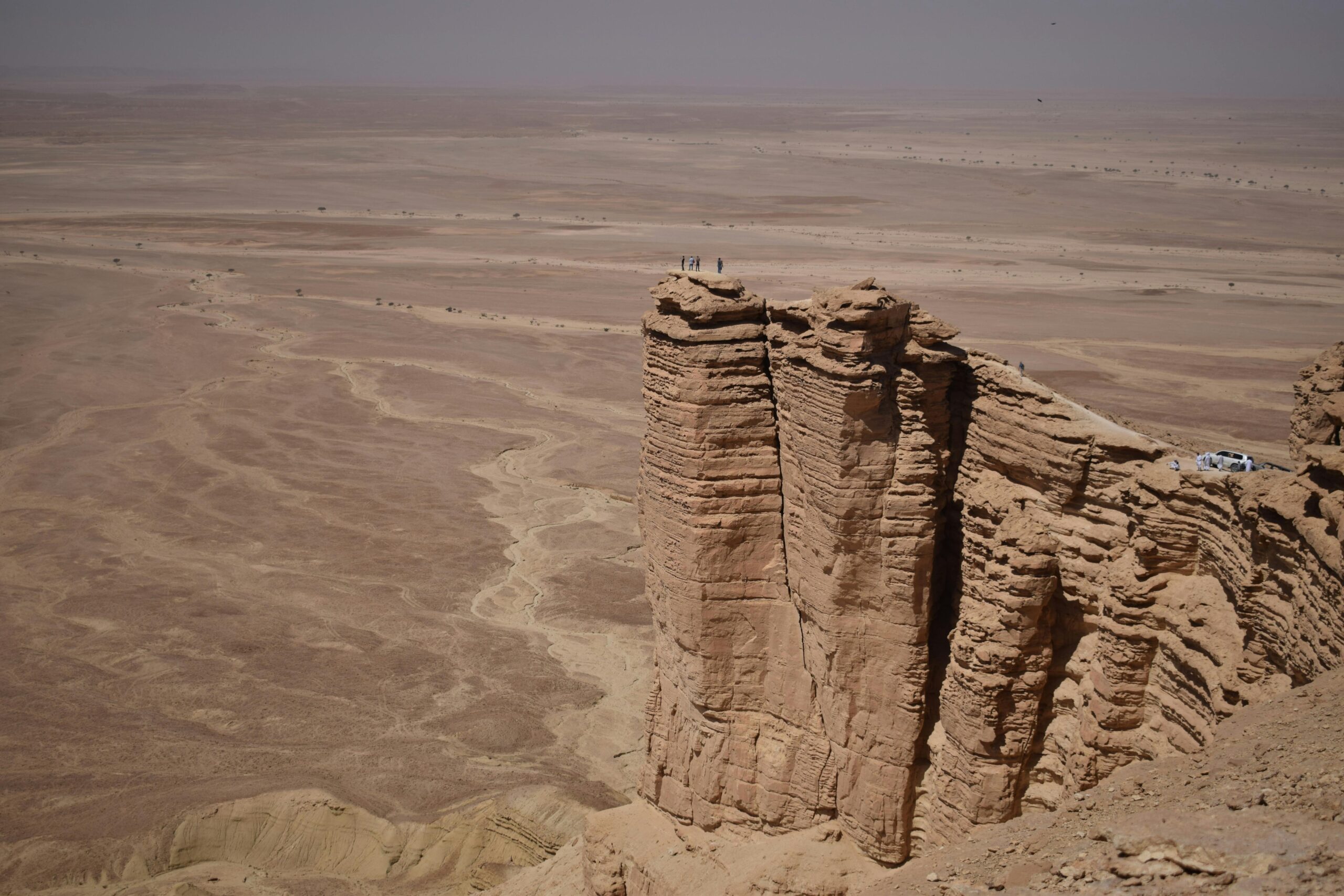 Home A breathtaking view of the rugged Tuwaiq escarpment rising above the Saudi Arabian desert.